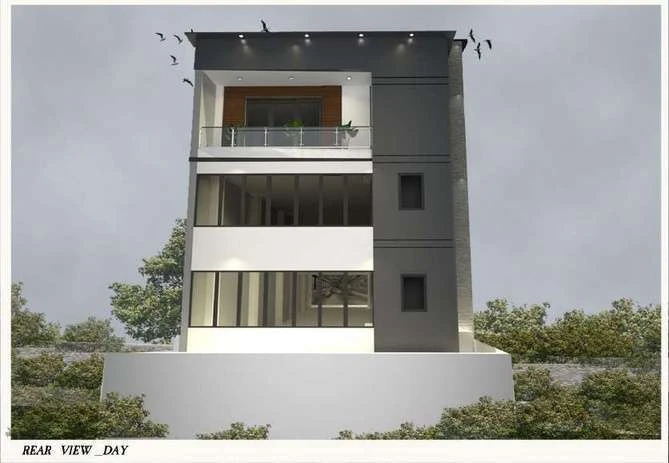 Rear view of the building in daylight showing the grey panel field and terrace railing.
