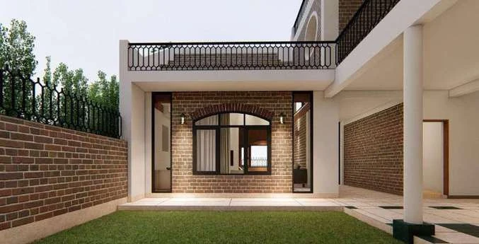Courtyard of the New Delhi residence looking back toward the covered verandah, brick boundary wall and lawn.