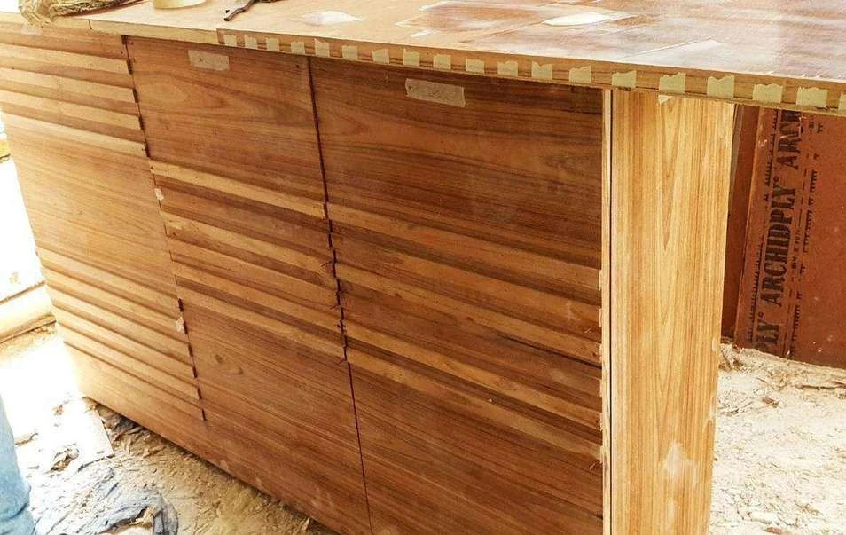 Site photograph of the bedroom console shutter design in timber, close up on the horizontal slat joinery.